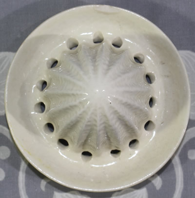 The reamer for a yellow orange peel texture with white reamer juicer
