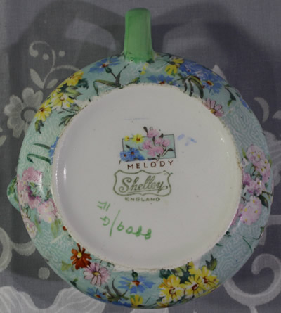 Basemarks on a Shelley yellow, white, red and blue flowers on green Melody juicer