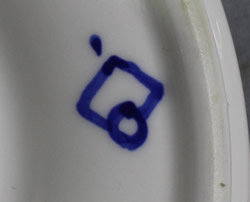 The basemark on a blue flowers on white ceramic zester 2 piece juicer