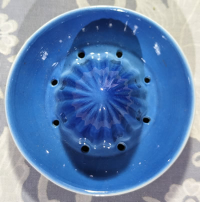 Top view of the reamer for a flesh colour and blue child juicer
