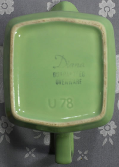 The base of a green Diana Ware jug juicer