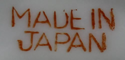 The basemark on a peach lustre ceramic saucer juicer