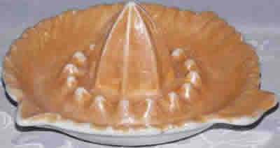 A fuller peach lustre ceramic saucer juicer