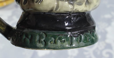 The impressed name on a John Barleycorn toby juicer