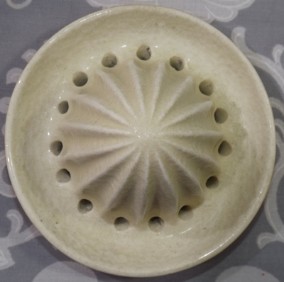 The reamer for an orange with orange & white top 2 piece ceramic