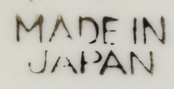 Base mark on Yellow and white Japanese 'peel' juicer