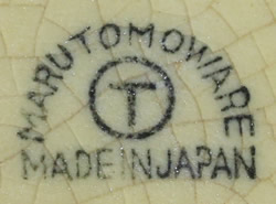 Marutomo Ware basemark on a cream and green ceramic swan straight cone juicer