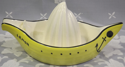 Side view of a yellow Beswick boat juicer