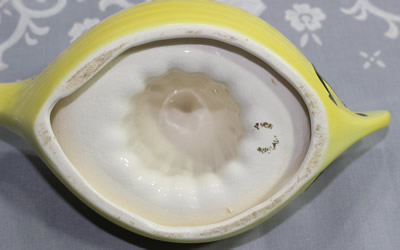 Partial basemark on a yellow Beswick boat juicer