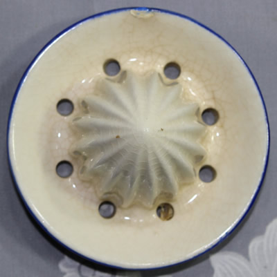 The reamer for a tan beak and blue wings duck ceramic juicer