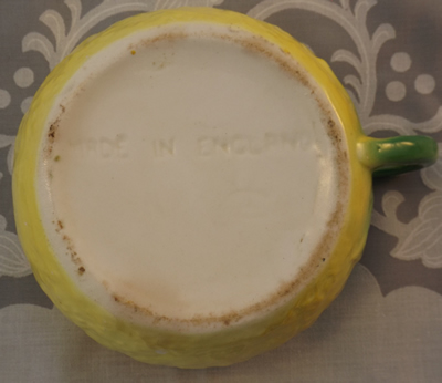 One base of a yellow 'peel' Beswick juicer