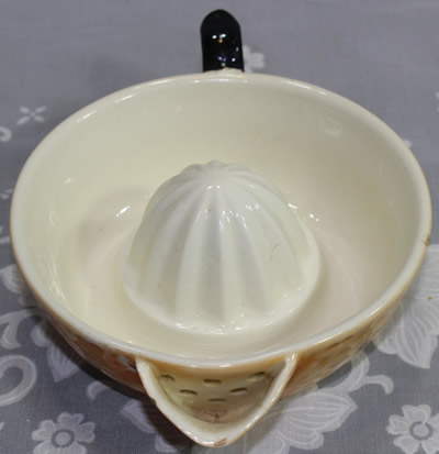 Strainer on a present from Margate souvenir ceramic juicer