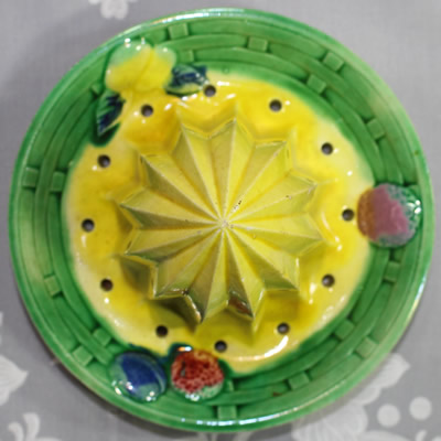 Large green, with yellow, pink, blue & tan juicer