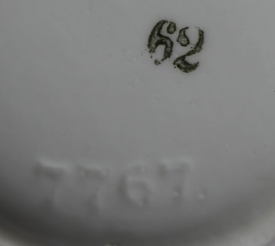 The basemarks on a cobalt blue trim German ceramic juicer