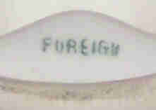 Foreign basemark on a pastel green ceramic juicer