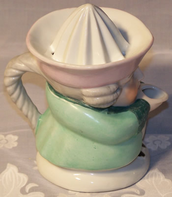 Right side of pale green with pink hat 1 piece toby juicer