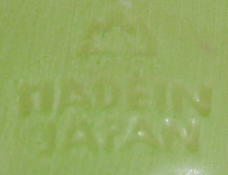 Impressed mark on 5¼" green, white & red clown juicer