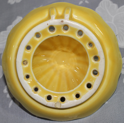 Reamer (bottom view) for yellow Carlton Ware fruit basket juicer