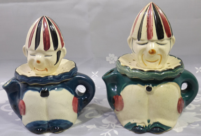 Two similar clown juicers