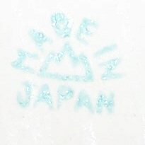 The basemark on a pale blue and white, yellow, red 5¼" clown juicer