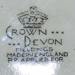 Base mark on yellow 'peel' & white top Crown Devon juicer