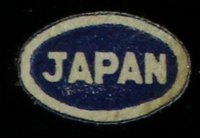 Blue Japan paper label on a black embossed with gold wheat shafts juicer with 6 tumblers 