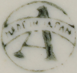 The basemark on a blue and white windmill juicer with 4 tumblers