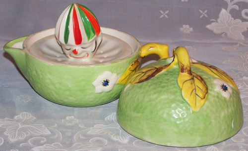 Open pale green with white flowers and yellow leaves clown 3 piece juicer