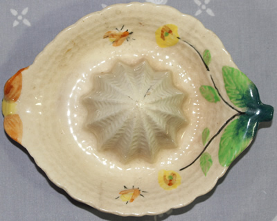Top view of beige with bees and yellow flowers saucer juicer