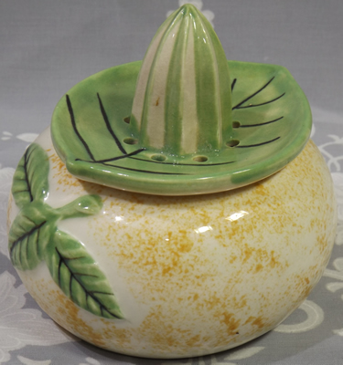 The back of an Orange Juice bowl with green leaf juicer showing the leaves