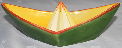 Sideview of green & Yellow stylised boat juicer