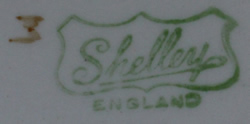 Basemark on Shelley orange bands drip glaze juicer