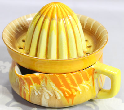 A 4th example of the orange Shelley scratched drip glaze juicers