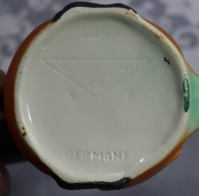 The impressed L.G. Co. Germany on an orange with black beak chick juicer
