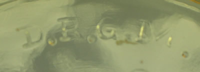 The embossed D.R.G.M. on a German amber glass juicer