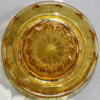 The reamer for an amber glass 2 piece juicer with offset loop handle