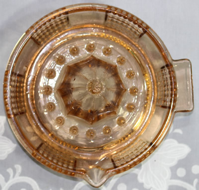 Top view of an amber Federal Glass saucer juicer