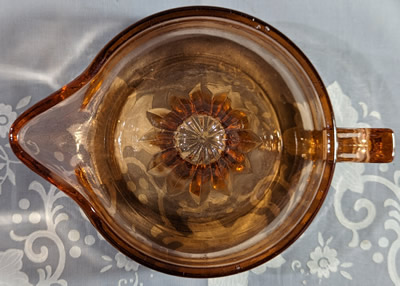 Top view of a large reproduction amber glass juicer
