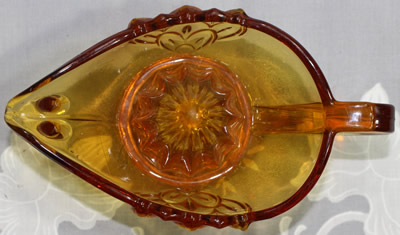 Top view of an amber Stolzle juicer