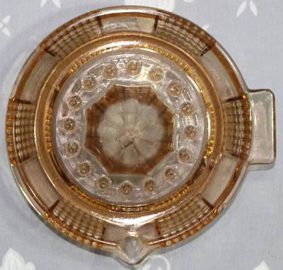 Top view of a brown Federal Glass saucer juicer