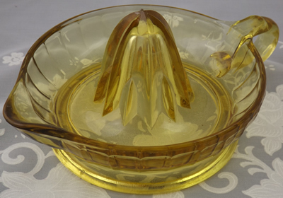 Alternate view of a large amber Federal Glass juicer 
