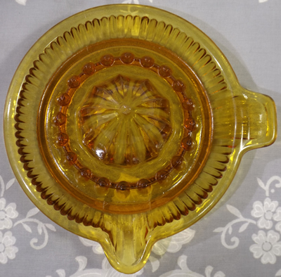 Top view of Davidson Glass amber saucer shape glass juicer