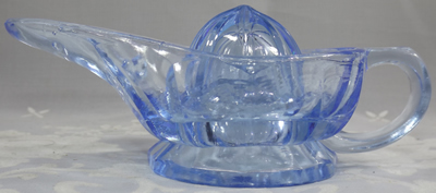 Side view of blue glass  'Aladdins Lamp' juicer