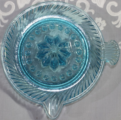 Blue glass with fan tab handle juicer top view