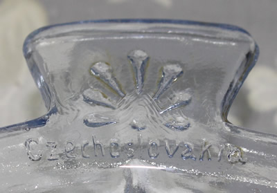 The embossing of "Czechoslovakia" on a blue 1 piece glass juicer