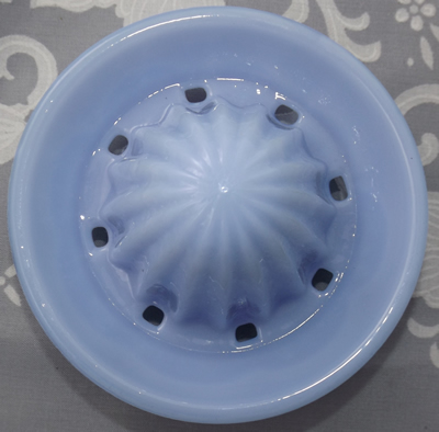 The reamer for a small Taiwan reproduction delphite 2 piece glass juicer