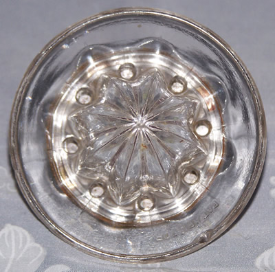 Top view of a glass on metal screw base juicer 
