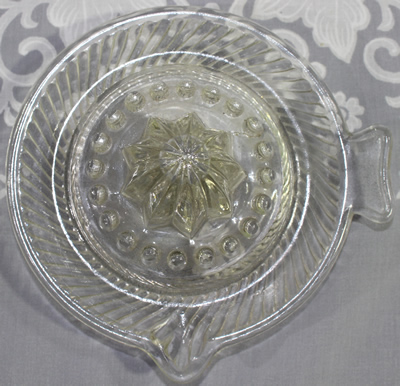 Dragon on tab handle clear glass saucer
