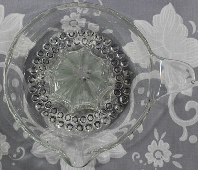 Top view of Nickel Plate clear glass saucer juicer