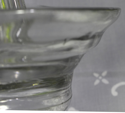 Profile of a large clear glass rippled bowl juicer